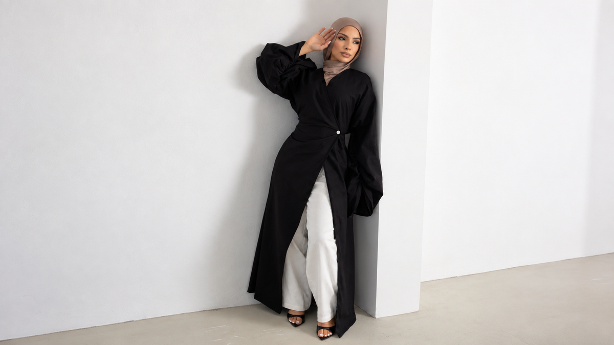 Orlena Signature Black longline top styled with white trousers and a taupe hijab