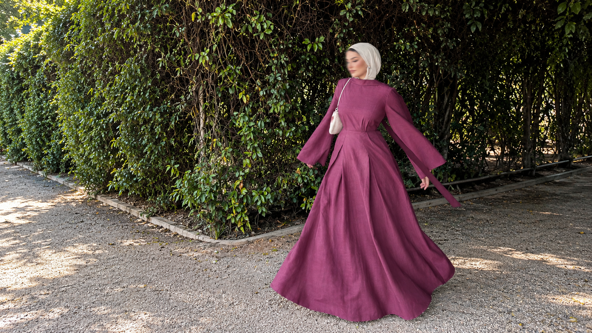 Sorelle Belted Modest Dress in plum styled with a hijab for an elegant full-length outdoor look