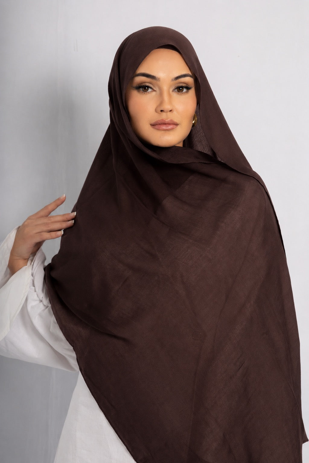 Front view of a woman wearing the Chocolate Brown modal hijab, featuring a rich chocolate brown colour, lightweight breathable fabric, and an elegant drape for modest everyday wear