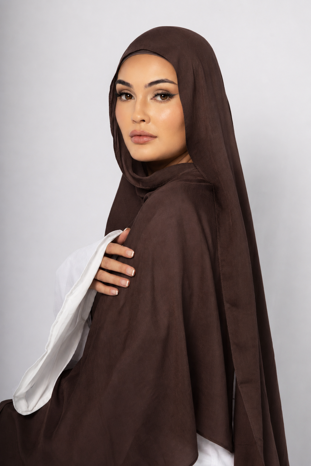 Side profile of a woman wearing the Chocolate Brown modal hijab, highlighting the rich chocolate brown colour, lightweight breathable fabric, and elegant modest drape