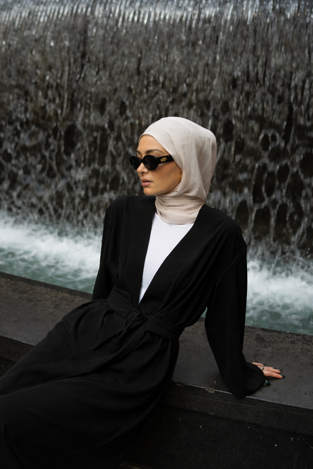 Rowan Belted Abaya in black by Orlena Official, a modest dress featuring a belted silhouette with a hijab styled look